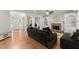 Bright living room boasts hardwood floors, fireplace, and built-in shelving at 5381 Fawn Meadow Ln, Powder Springs, GA 30127