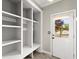 Functional mudroom featuring shelving and a door to the exterior at 5381 Fawn Meadow Ln, Powder Springs, GA 30127