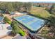 Multiple professionally maintained tennis courts surrounded by lush landscaping, lights and fencing in a desirable community at 5381 Fawn Meadow Ln, Powder Springs, GA 30127