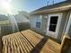 A sunlit wooden deck outside the house, perfect for relaxing or entertaining at 221 Huntington Dr, Mcdonough, GA 30253