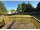 A backyard deck with a view of the fenced yard and surrounding greenery at 221 Huntington Dr, Mcdonough, GA 30253