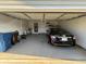 A clean, organized two-car garage with ample space for storage and parking at 221 Huntington Dr, Mcdonough, GA 30253