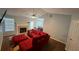 Comfortable living room with fireplace, view into dining space, ceiling fan and lots of light at 221 Huntington Dr, Mcdonough, GA 30253