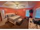 Serene primary bedroom featuring a tray ceiling, neutral color scheme, and ample natural light at 221 Huntington Dr, Mcdonough, GA 30253