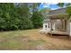 Spacious backyard featuring a new deck and lush landscaping, perfect for outdoor living at 3860 Rajean Dr, Lawrenceville, GA 30044