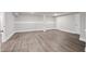 Finished basement with modern flooring and neutral-toned walls at 3860 Rajean Dr, Lawrenceville, GA 30044