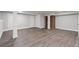Spacious basement with hardwood-style floors and a neutral color palette at 3860 Rajean Dr, Lawrenceville, GA 30044