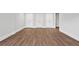 A spacious basement featuring modern flooring and three white paneled doors at 3860 Rajean Dr, Lawrenceville, GA 30044
