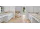 Bathroom features a soaking tub, dual vanities with granite countertops, and tiled floors at 3860 Rajean Dr, Lawrenceville, GA 30044
