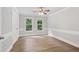 Bedroom with vinyl floors, natural light, and white walls at 3860 Rajean Dr, Lawrenceville, GA 30044