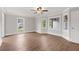 Open bedroom design featuring hardwood floors, neutral paint, crown molding and multiple windows at 3860 Rajean Dr, Lawrenceville, GA 30044