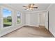 Bedroom features hardwood floors, neutral paint, and a ceiling fan, offering a comfortable space at 3860 Rajean Dr, Lawrenceville, GA 30044