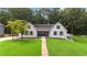 Well-maintained home with a lush front lawn, showcasing its inviting curb appeal at 3860 Rajean Dr, Lawrenceville, GA 30044