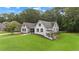 Beautiful home on a large lot with a sprawling green lawn and mature trees at 3860 Rajean Dr, Lawrenceville, GA 30044