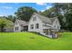 Charming two-story home featuring a well-manicured lawn, and traditional architectural design elements at 3860 Rajean Dr, Lawrenceville, GA 30044