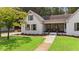 Charming home with a well-kept lawn and inviting front porch at 3860 Rajean Dr, Lawrenceville, GA 30044