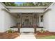 Charming front porch with a decorative lighting fixture and bench seating, welcoming guests to the home at 3860 Rajean Dr, Lawrenceville, GA 30044