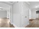 Hallway with white trim, vinyl flooring, and access to various rooms at 3860 Rajean Dr, Lawrenceville, GA 30044