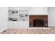 Close up of the living room featuring built-in shelving and a decorative brick fireplace at 3860 Rajean Dr, Lawrenceville, GA 30044