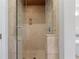 Walk-in shower featuring a glass enclosure, tile surround, and chrome fixtures at 3860 Rajean Dr, Lawrenceville, GA 30044