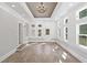 Bright sunroom with coffered ceiling, chandelier, and many windows at 3860 Rajean Dr, Lawrenceville, GA 30044