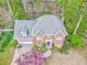 Beautiful brick home with attached garage, mature trees and landscaping at 4327 Saint Michaels Dr, Lilburn, GA 30047