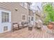 Wooden deck with furniture and grill, perfect for outdoor gatherings and relaxation at 4327 Saint Michaels Dr, Lilburn, GA 30047