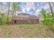 Large backyard with a deck overlooking the landscape, great for outdoor activities at 4327 Saint Michaels Dr, Lilburn, GA 30047