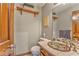 Small half bath with unique sink, light tile, and decorative wall art at 4327 Saint Michaels Dr, Lilburn, GA 30047