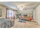 Neutral carpet, sloped ceilings, a large window, a daybed and furniture add to bedroom's appeal at 4327 Saint Michaels Dr, Lilburn, GA 30047