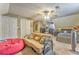 Bedroom with a neutral carpet, sloped ceilings, a large window, a daybed and furniture at 4327 Saint Michaels Dr, Lilburn, GA 30047