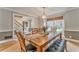 Spacious dining room with hardwood floors, a large wooden table, and plenty of natural light at 4327 Saint Michaels Dr, Lilburn, GA 30047