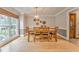 Cozy dining area with natural lighting, hardwood floors, and traditional furniture at 4327 Saint Michaels Dr, Lilburn, GA 30047