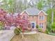 Beautiful two-story brick home with well-maintained landscaping and charming curb appeal at 4327 Saint Michaels Dr, Lilburn, GA 30047