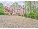 Charming brick home with a well-manicured front yard, mature trees and a classic design at 4327 Saint Michaels Dr, Lilburn, GA 30047