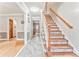 Inviting foyer with hardwood floors, elegant staircase, and neutral wall colors at 4327 Saint Michaels Dr, Lilburn, GA 30047