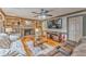 Inviting living room with a brick fireplace, built-in shelving, and comfortable seating at 4327 Saint Michaels Dr, Lilburn, GA 30047