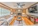 Charming living room with hardwood floors, brick fireplace, and natural light at 4327 Saint Michaels Dr, Lilburn, GA 30047