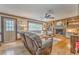 Cozy living room with hardwood floors, brick fireplace, and built-in bookshelves at 4327 Saint Michaels Dr, Lilburn, GA 30047