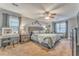 Large main bedroom with sitting area, natural light, and ceiling fan at 4327 Saint Michaels Dr, Lilburn, GA 30047