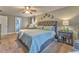 Comfortable main bedroom features a large bed, nightstands, and a sitting area at 4327 Saint Michaels Dr, Lilburn, GA 30047