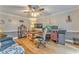 Bright home office with hardwood floors, a ceiling fan, a large desk, and a comfortable seating area at 4327 Saint Michaels Dr, Lilburn, GA 30047