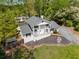 Aerial view of a two-story white brick home with a dark roof and manicured lawn at 503 Duke Dr, Marietta, GA 30066