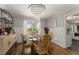 Elegant dining room featuring hardwood floors, decorative ceiling and window views at 503 Duke Dr, Marietta, GA 30066