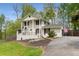 Traditional two-story home featuring white brick, dark trim, and a well-manicured lawn at 503 Duke Dr, Marietta, GA 30066