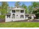 Charming white brick two-story home with a manicured front yard and classic architectural details at 503 Duke Dr, Marietta, GA 30066