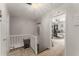 Hallway with carpeted stairs, decorative lighting and a view into the makeup room at 503 Duke Dr, Marietta, GA 30066