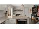 Spacious kitchen with a fireplace, granite countertops, stainless steel appliances, and modern lighting fixtures at 503 Duke Dr, Marietta, GA 30066