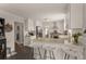 Well-appointed kitchen featuring a granite countertop island, stainless steel appliances, and barstool seating at 503 Duke Dr, Marietta, GA 30066