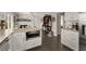 Open-concept kitchen with granite countertops, stainless steel appliances, and dark brown flooring at 503 Duke Dr, Marietta, GA 30066
